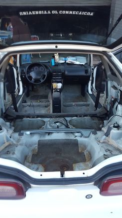 Aluminum to replace side panels and a roll cage. More sanding for the light rust and a box to cover spare tire compartment and fuel line. (Pic looks dirty, i vaccumed and washed down the area and carpet. Forgot to take pic of after lol .)