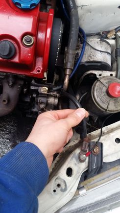 This wire is right next to the driver side headlight and connects between the engine itself and the frame above the headlight. Can't miss it.