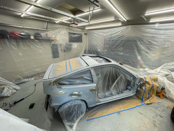 At first the rear quarter windows stayed in and then opt’d t remove them…the new passenger door I was able to snag was black and Im ocd Sooo I turned my garage into a makeshift booth and decided to just respray the whole car.