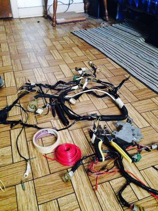 Removed the harness again. Main extension and rewiring a few plugs. This thing was pretty hacked up.