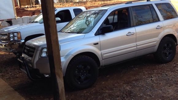 This is how it sits next to my friend's 2in leveled Silverado on 35in Trail Grapplers.