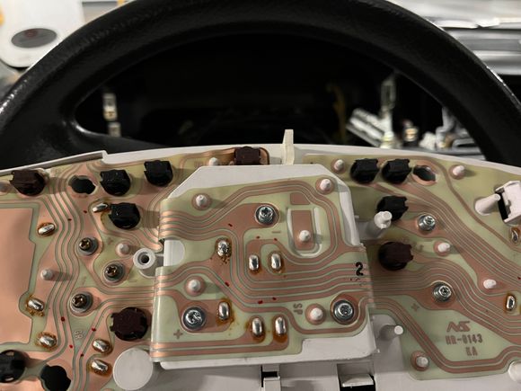 upper left solder joint in the speedometer section (middle), re-flowed