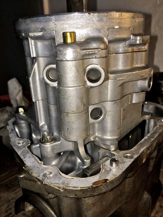 The brass looking thing is the thermal switch. That will be removed and I would like to try to plumb the air into that opening.