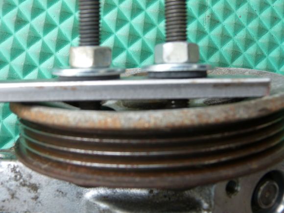 You can't see it, but there are washers and rubber washers on the other side of the pulley, too.
