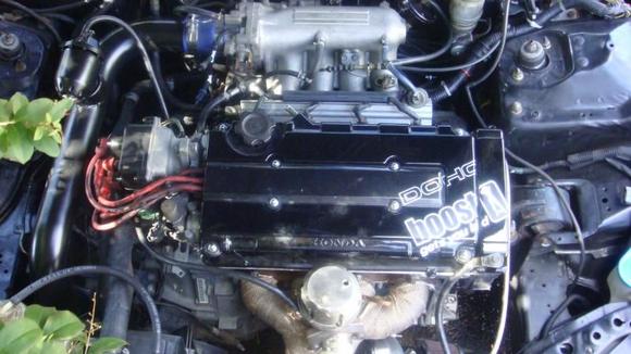custom painted valve cover, shaved n professionally sprayed blk, sealed the deal with the infamous "boost get's yo laid" decal