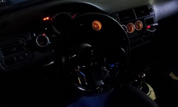 Autometer Oil Temp. Oil Pressure, Voltmeter &amp; Boost/Vacuum gauses. AEM UEGO wideband. Aftermarket headunit moved to bottom console.