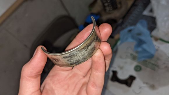 The worst of my main bearings. My con rod bearings don't look great either. None of them look particularly good, but I can't decide if they're fully spun or dangerously close to doing so.