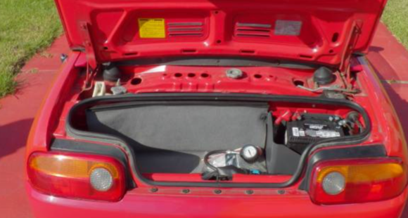 The trunk/engine boot.  Panel comes off behind carpet to access intake.  Motor's all stock.  Everything.  How much more clear can I make it.  Car runs excellent, full service performed at 14k miles.  Current miles 17k.