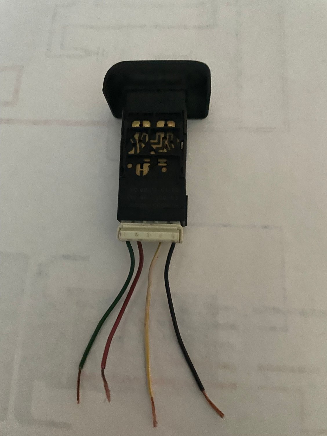 Cruise Control switch with Fog light cap.  Wires numbered 1-5 left to right, with 3 being empty. Green-1, Red-2, yellow (or white-faded?)-4, Black-5