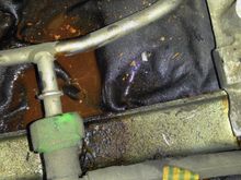 coolant puddle in area beneath ignition coils