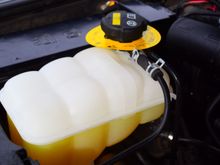Replaced defective/cracked coolant expansion tank with new unit. So far no visiable cracks or leaks.