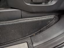 A rear pointing seat guard 