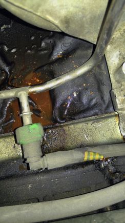 coolant puddle in area beneath ignition coils