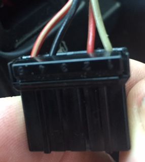 Second from top wiring harness on left of dash (US).  Had a blank/non-functional cover