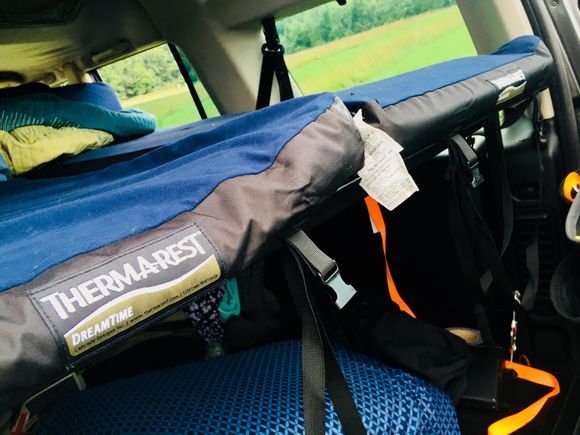 2 self inflating mattress that can accommodate up to 6 ft. 4 inches tall on a convertible deck that can be used as a table as well.