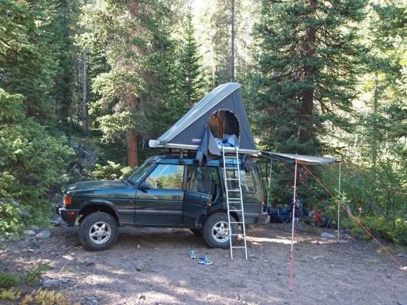 Camping.  Autohome Columbus Carbon rooftop tent and Foxwing awning deployed