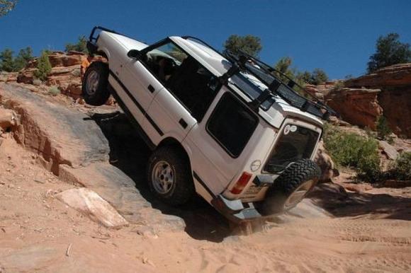 Wheels up while going up Upchuck obstacle near Moab