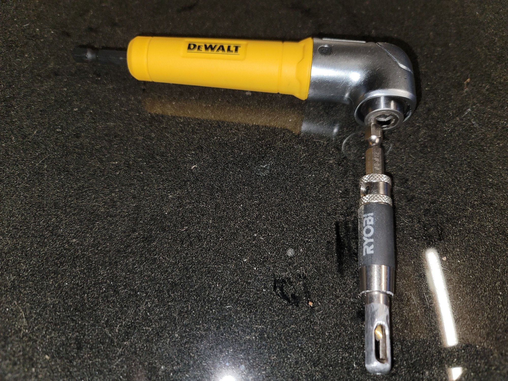 Right angle adapter w Ryobi door hinge bit set. Replaced bit w cobalt teverse bit. Needed to dremel exterior of ryobi to help fit in bolt hole.