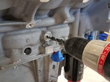 Since I'm installing a LS2 block into a 2001 Camaro, I have to install the knock sensors on the side of the block. I used a 11/32" drill bit to drill out the stock threads for the LS2 sensors.