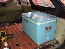 And here we have my beautiful "vintage" Coleman cooler. I don't remember if I told you guys about this thing yet, but I bought it shortly after acquiring the wagon, and the numbers on it say it was built the same year as the wagon, so logic dictated I bolt them together. I essentially welded bolts to metal plate and riveted it to the bottom of the cooler (I used many rivets, I don't feel like getting brain trauma from my own beloved cooler while I'm rolling through the air at 100 miles an hour)