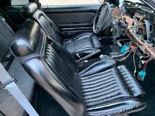 These are vinyl seats that had been "painted" black.  My OEM, black cloth seats will be going in