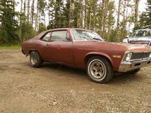 This is my 71 Acadian that I bought when I was 15. I drove it for a few years, then the timing chain went and it just got parked for ten years. It came with a horrible 307 and is incredibly rusty and not worth fixing. I love this car though and have lots of good memories in it. The interior is actually pretty sweet and black so I used it on the 73