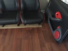 Seats with painted door panel and color matched speaker grills.