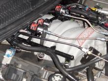 Used factory loom to hide the ground wires for the solenoids.
Bolt on the front of the passenger side head used for ground.