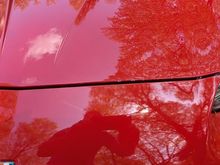 Small rock chips on the edge of the hood