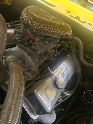 The carb has a small fittong to hook a hose to. I heard this is where then trans line goes to, but mine is hooked to my intake manifold in the back of the carb. The brake.boosyer is hooked to the back of the carb.