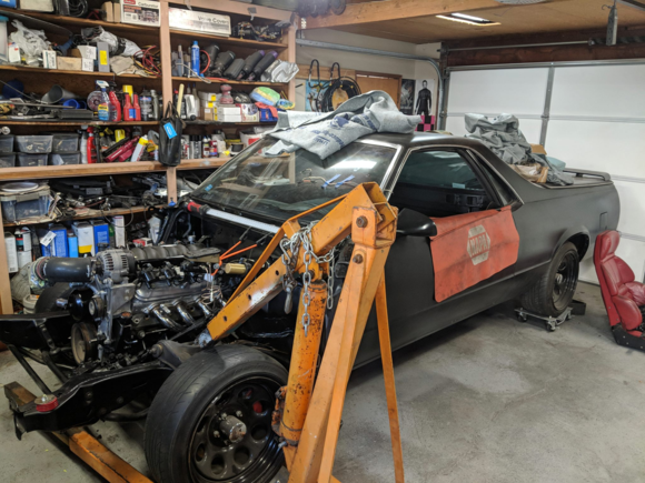 The engine is in the "stock" location and its the same height it should have been with the factory mounts.  Plus the F-body headers dropped right in from the top!