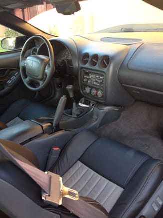 16.  Front seat area.  I wish I had taken before pictures.  Imagine torn leather and ruined seat foam all over the car