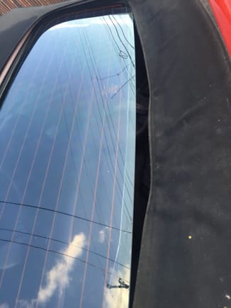 Bottom portion of the window is detached from convertible top