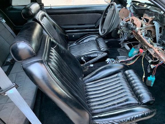 These are vinyl seats that had been "painted" black.  My OEM, black cloth seats will be going in