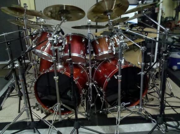 Classic 1982 Tama Superstar kit in cherrywine and mahogany. I bought most of the kit as a set in cherrywine, then added additional pieces, but due to availability some pieces are mahogany. It's hard to see the difference in color in the pics. 14 pieces, 13 cymbals. Snare is a limited edition Tama Warlord Valkerie, less than 1000 units made for distribution in the US. Kit is mic'd out and connected to 2 Presonus mic preamp/interface boxes for recording. We lost our guitar player, he moved, so it's just me and a bass. We do still record and the lay a guitar track in later. Bass player can also play guitar. Lots of fun. We're working on several songs at the moment, nothing finalized yet.