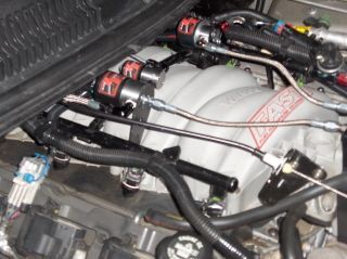 Used factory loom to hide the ground wires for the solenoids.
Bolt on the front of the passenger side head used for ground.