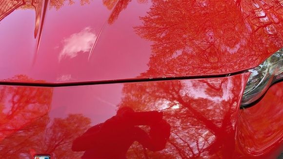 Small rock chips on the edge of the hood