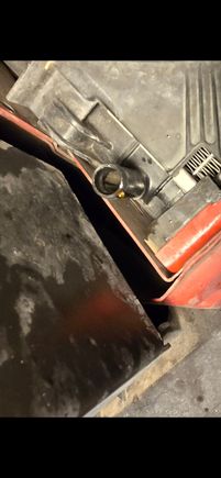 There's no threads outside or inside the tube so I know its some kind of hose with clamp that attached there.  