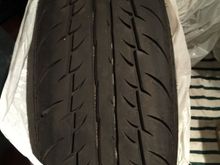 The white lines you see in the tread is not a defect. It's the marks when the tires were new.
