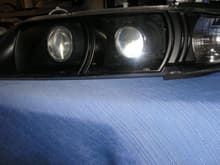 All blacked out r34 dual projector retrofit tsx projectors and valeo halogens