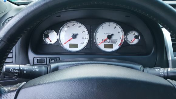 Custom white SE gauge overlays with chrome rings
