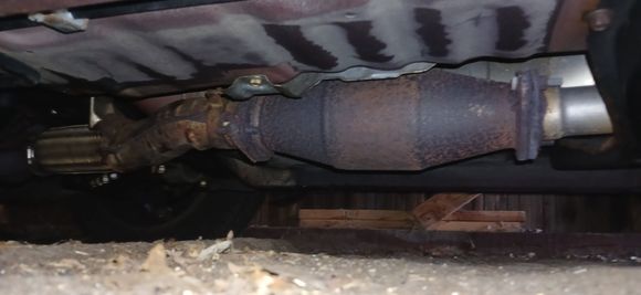 Main rear cat is 'exhausted'... no pun intended. Measurement of rear cat is 13 inches incl flanges. Severe rotten egg smell, but no codes. The fuel gauge sending unit is sticking so it's all over the place. It goes to 3/4 tank full, then 1/3 full, so I never know how much fuel is in her.