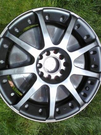 Wheel painted, looks much nicer than those white pieces of crap. This was just before the clearcoat/polish