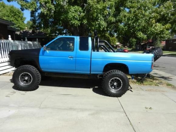 Most Current Picture - 35" Tires, Dual Rail Light Bar, 8" Long-Range Lights, Tire Gate w/ 35" Spare, both lift kits.

A few things are missing in this picture, the side-rails, the front bumper, some paint stuff.... Still getting everything put back together.