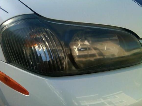 Cracked open the headlights and blacked them out as well.