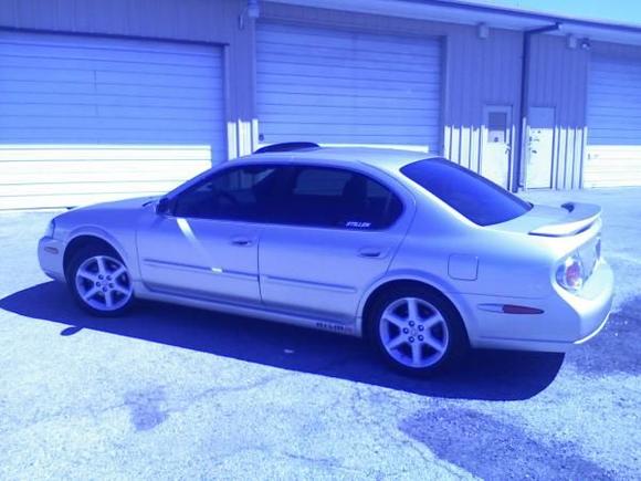 2002 Maxima SE - Stock HIDs, GoodYear Eagle F1s, HKS Sport Exhaust, and 35% Tint.