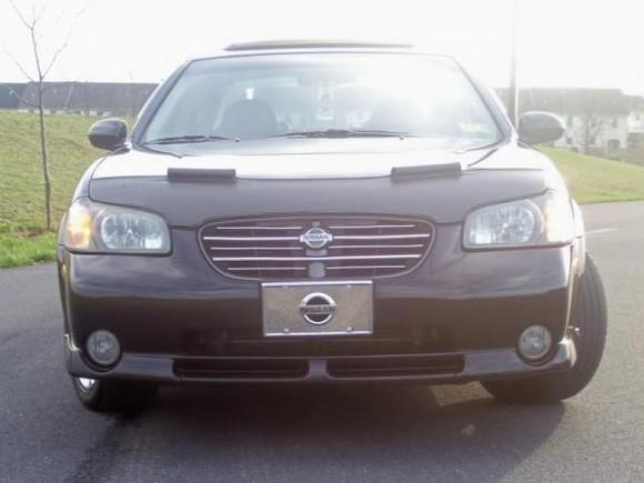01 Maxima 20th Anniversary (in 2009).  No aftermarket headlights.  I like the Anniversary bronze tint these have.  Hard to see in pics but it's there.