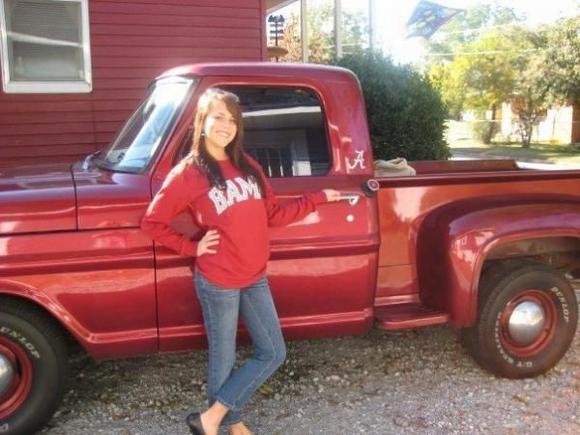 Girlfriend's friend posing in front of the truck.