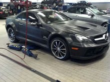 Wanna be SL 65. its an SL550 with a horrible body kit and a full body wrapped in carbon fiber tape .