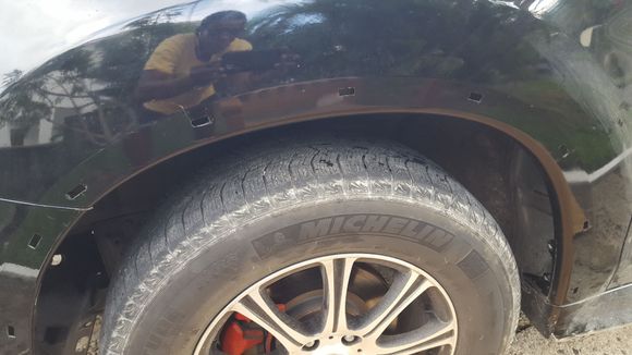 Pic of the holes cut into the fender. Holes actually come pre cut in the bumper as you can see so the makes it a lot easier to continue.